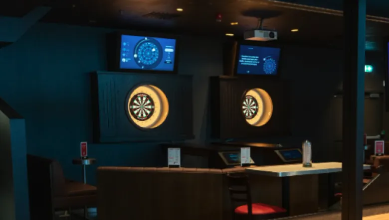 FLYBY Darts oches with illuminated boards and scoring screens